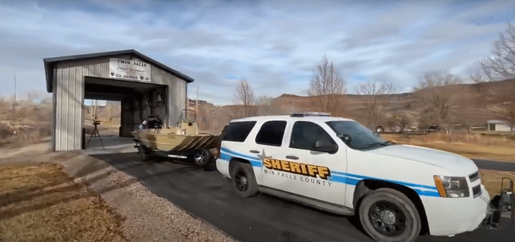 An image of the Twin Falls Water Rescue garage with a police SUV towing a boat