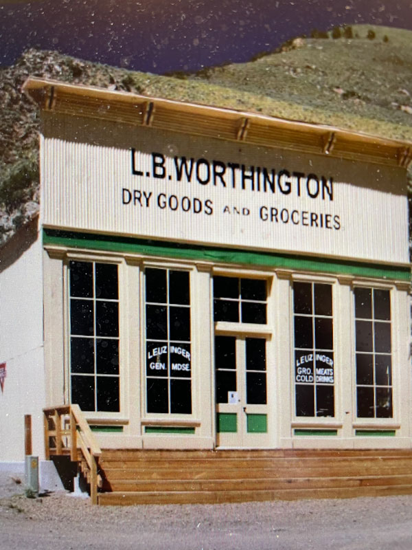 A photo of the front of a vintage museum. The words "L.B. Worthington Dry Goods and Groceries" can be read from the front.